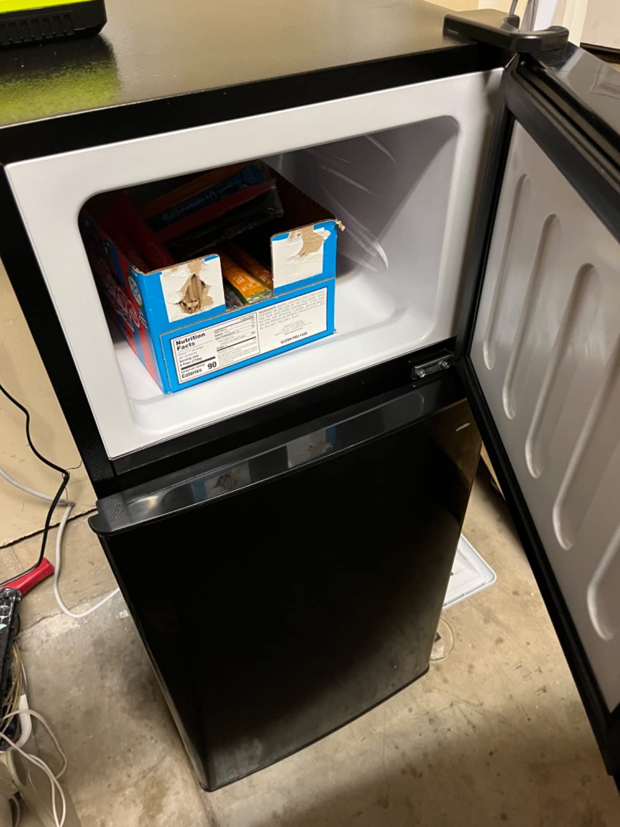 Anukis customer photo — mini fridge stocked with drinks